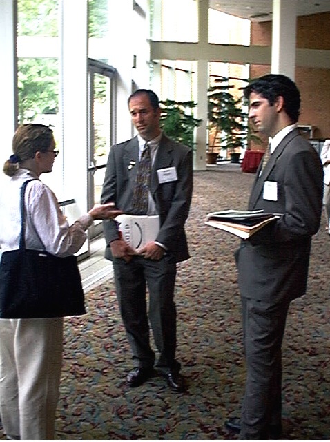 Rand and Philip Speak with an Attendee