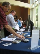 Conference Attendees Pick Up GALILEO Handouts
